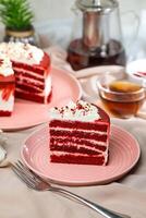 Premium Red Velvet cake and slice include cream, sugar with fork, cup of coffee and pot served on board isolated on napkin side view of cafe food photo