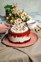 Premium Red Velvet cake include cream, sugar with fork, knife and flowers served in plate isolated on napkin side view of cafe food photo
