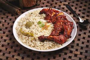 Arabian Chicken Lamb Mandi or biryani served in dish isolated on table side view of middle east food photo