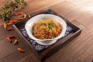 Spicy ants on the tree noodles served dish isolated on wooden table top view of Hong Kong food photo