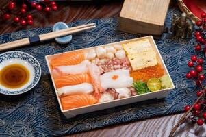 Salmon Mixed Seafood Don in a dish with chopsticks isolated on mat side view of taiwan food photo