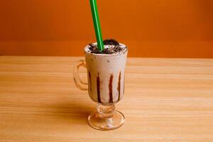 Oreo Milkshake served in glass isolated on table top view bangladeshi drink photo