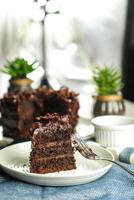 Chocolate Fudge Cake with fork and knife served in plate on food table top view cafe bake dessert photo
