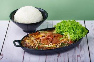 Asian food Rice Teriyaki Lion Mane Shroom with veg in bowls on wood table photo