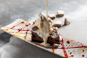 Mud Pie cake with ice cream served in dish isolated on table top view of arabic breakfast photo