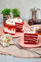 Premium Red Velvet cake and slice include cream, sugar with fork, cup of coffee and pot served on board isolated on napkin side view of cafe food photo