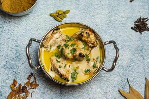 Butter chicken or Murgh makhni served in a dish isolated on grey background top view of bangladesh food photo