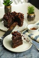 Chocolate Fudge Cake with fork and knife served in plate on food table top view cafe bake dessert photo