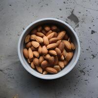 AI generated From Above Ceramic Bowl with Organic Almonds on Concrete Surface For Social Media Post Size photo