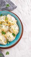 AI generated Appetizing cabbage dumplings on clean, white background, ready to enjoy Vertical Mobile Wallpaper photo