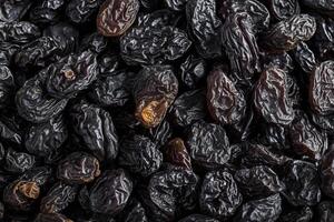 AI generated Dried grape delight Black raisin texture, a popular snack photo