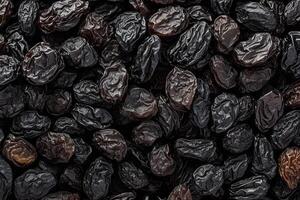 ai generado seco Fruta textura negro Pasas, popular y delicioso seco uvas foto