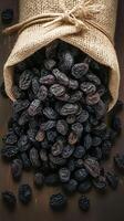 AI generated Natural sweetness Black raisins in burlap bag on rustic background Vertical Mobile Wallpaper photo