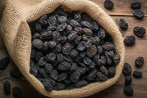 AI generated Rustic raisin display Black raisins in burlap bag on wooden table photo