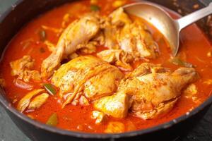 AI generated Exotic flavor Red curry chicken prepared in Muslim culinary style photo