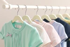 AI generated Colorful childrens wear Pastel shirts on a hanging rack photo