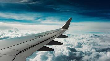 AI generated Modern Aircraft Wing Flying Through Cloudy Blue Sky photo