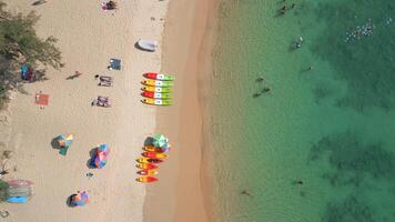 People relaxing on tropical beach on Phuket island in Thailand. video