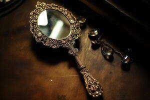 AI generated An ornate antique hand mirror with a filigree frame. Generative AI photo