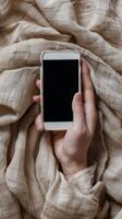 AI generated Person Holding Smartphone Under Blanket photo