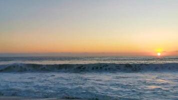 Colorful golden sunset big wave and beach Puerto Escondido Mexico. video