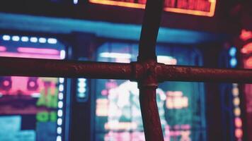 A close up of a metal fence with neon lights in the background video