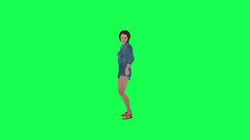 3d rebelle fille dans jeans tournage pistolet de face angle vert écran video