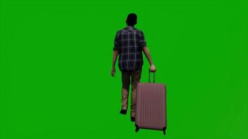 Young tourist walking with luggage from the back angle video