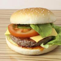 AI generated Fresh tasty burger with fried meat, cheese, lettuce and tomatoes. AI generated. photo