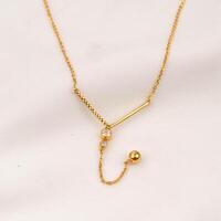 gold necklace jewelry with beautiful balls photo