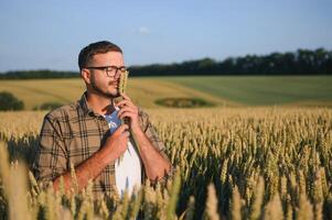 Portrait of farmer in wheat field photo