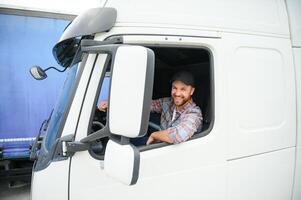 driver behind the wheel in truck cabin photo