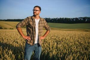 Portrait of farmer in wheat field photo