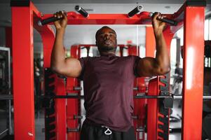 African American young man doing workout at the gym photo