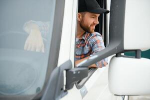 driver behind the wheel in truck cabin photo