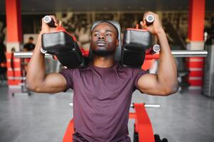 African American young man doing workout at the gym photo