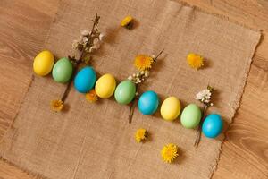 Paint eggs for Easter, bright Easter holiday, children paint eggs, colored eggs in a basket, colored eggs on a stand, Holiday background photo