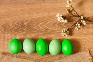 Paint eggs for Easter, bright Easter holiday, children paint eggs, colored eggs in a basket, colored eggs on a stand, Holiday background photo