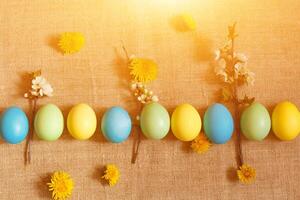 Paint eggs for Easter, bright Easter holiday, children paint eggs, colored eggs in a basket, colored eggs on a stand, Holiday background photo