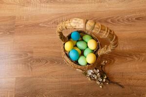 Paint eggs for Easter, bright Easter holiday, children paint eggs, colored eggs in a basket, colored eggs on a stand, Holiday background photo