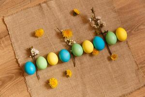 Paint eggs for Easter, bright Easter holiday, children paint eggs, colored eggs in a basket, colored eggs on a stand, Holiday background photo