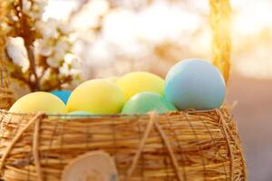 Paint eggs for Easter, bright Easter holiday, children paint eggs, colored eggs in a basket, colored eggs on a stand, Holiday background photo