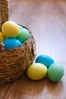 Paint eggs for Easter, bright Easter holiday, children paint eggs, colored eggs in a basket, colored eggs on a stand, Holiday background photo