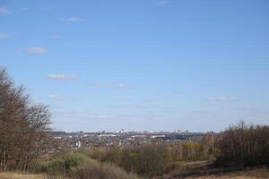 landscape with mountains, burn and sky, view of the city, mountains and trees in spring, spring photo