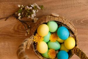 Paint eggs for Easter, bright Easter holiday, children paint eggs, colored eggs in a basket, colored eggs on a stand, Holiday background photo