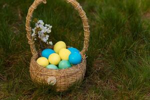 Paint eggs for Easter, bright Easter holiday, children paint eggs, colored eggs in a basket, colored eggs on a stand, Holiday background photo