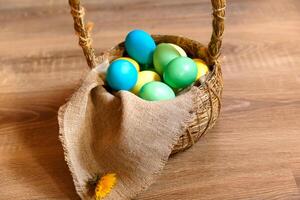 Paint eggs for Easter, bright Easter holiday, children paint eggs, colored eggs in a basket, colored eggs on a stand, Holiday background photo