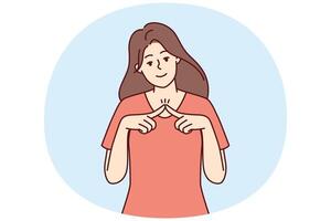 Shy girl looks at camera and joins fingers in front of chest, wanting to seduce guy vector