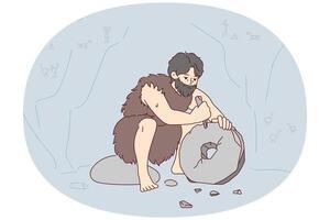 Ancient man with beard who lives in cave uses stone tool to create wheel. Vector image