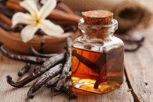 AI generated Vanilla extract in a glass bottle with aromatic pods and spices on a rustic wood table photo